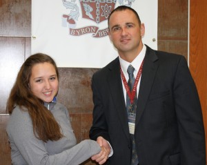 Christine Burke is congratulated by Jr./Sr. High School Principal Aaron Johnson for being recognized as a Commended Student in the 2014 National Merit Scholarship Program. 