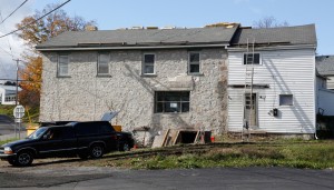 The east view of the Stone Store shows the work that is being done to replace the roof shingles. Joe stated: “I want to replace the roof shingles and construct the front porch before the winter weather settles in. We plan to put a business on the first floor and an apartment on the second floor."