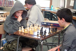 Fifth-grader Joey Oliver (left) contemplates his next move against Elijah Weider during the chess tournament.