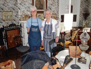 Deb Talley (left) and Sue Savard spent many hours organizing the Victorian Parlor in the Emily Knapp Museum.