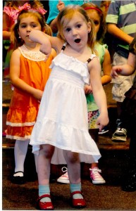 Preschooler Anelise Mott, adds emphasis to her singing role.