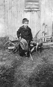 Joe at five years old: This is me the year before I went to school. Apparently it was practice for the coming years when I would develop “pheasantitis on opening day of the season.” Note my double barreled pop gun. October 1941.