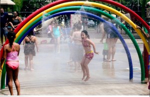 Greece resident Dianna Volpe, 6, thoroughly enjoyed the rainbow mister at the water facility in Pineway Ponds Park in Ogden.