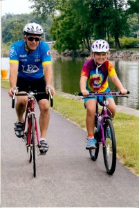 Spencerport residents and bicyclists Rob Vink and daughter Rylee, 9, take a turn on the popular Erie Canalway Trail in Spencerport.