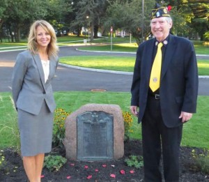 Gil Budd and Lori Orologio at Memorial Stone, an area which now has a new flagpole and new garden.