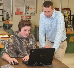 Student Logan Wencek and teacher Casey Coon explore the Hour of Code tutorials during Computer Science Education Week at Brockport’s Oliver Middle School. 