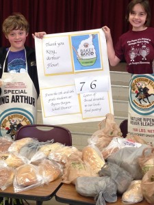 Byron-Bergen Elementary School students show off their home-made bread  - 83 loaves by the time the final count came in. Students representatives (l - sixth-grader Aiden Kulikowski and r - fifth-grader Sadie Cook) sent their thanks to King Arthur Flour for allowing them to participate in the Bake for Good Program. 