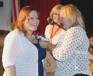Leah Oltean, Hilton School District Teacher of the Year, is congratulated by Committee Chairperson Debbie Montrallo (back) and Committee member Karen Velyk.