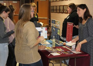 Representatives from Genesee Community College and St. John Fisher College discuss their academic programs with Byron-Bergen students. Provided photo