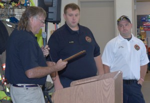 During a short program on October 4, Hamlin Morton Walker Fire District Chairman Jim Guion presented a plaque to the Morton Fire Company, accepted by Morton Fire Company President Mike Robb (center) and Battalion Chief Randy Davis. The plaque recognized the Morton Fire Company for its ideas and input from members, multiple company work details, and “incredible” patience in the planning, construction and completion of the fire station renovation project. Provided photo