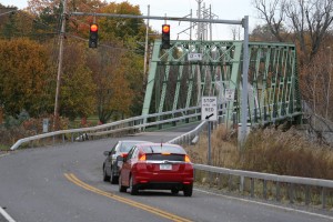 In 2016, the NYSDOT expects to close the Union Street/Route 259 Erie Canal bridge in the village of Spencerport. With a reduced weight limit, the Gillett Road bridge could not accommodate any heavy vehicles since its posting at 8 tons. Upgrading the Gillett Road bridge (shown above before it was closed November 2) will take about a month. W. Horylev photo