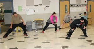  Participants perform lunges, led by Scott Haug (wearing hat), owner of S & S Fitness and Martial Arts Center, during the December meeting of the Holley’s Biggest Winner Weight Reduction Contest. Provided photo