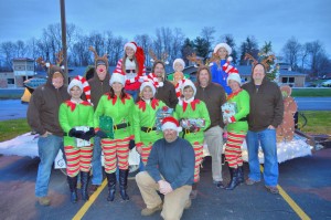 Santa's First Run gathers for a group shot including many holiday characters such as Rudolph and his reindeer friends, Santa's elf helpers and Santa himself. R. Nicholson photo