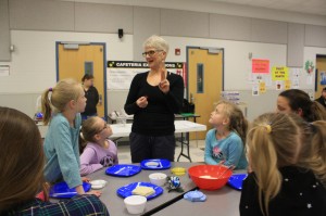 Karen Blank instructs students and their families on making a healthy dinner. Provided photo