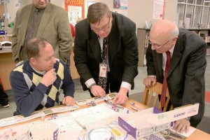 BOCES 2 Coordinator of School Library Systems Jim Belair (middle) explains to Assemblyman Steve Hawley (left) and Holley Superintendent Robert D’Angelo how littleBits work. Provided photo