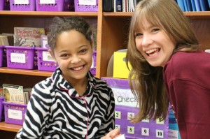 Hope DioGuardi, a fourth grader in Jessica Thompson’s class at Northwood Elementary School, spends time with Erika Hryhorenko, a sophomore at Hilton High School, as part of the district’s Cadet Connect Day. Provided photo