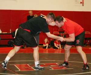 From left, Andrew Grillo takes on his brother, Ashley, in a pre-game wrestling match. Provided photo