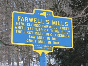 A state historical marker along State Route 237 in the Town of Clarendon marks the spot where the Farwell family constructed mills.  Jessie Brockway, a senior at Spencerport High School, is a descendent of the Farwell family on her mother’s side, and recently completed research on her ancestors in Clarendon for her senior project. K. Gabalski photo