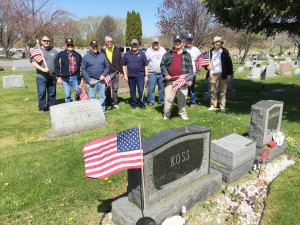 Members of Hiscock-Fishbaugh American Legion Post 788, Veterans of Foreign Wars Post 6105 and the Hilton-Parma Honor Guard place flags on Veterans’ headstones at Parma-Union Cemetery May 6. Provided photo