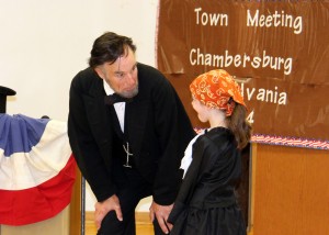 Harriet Tubman, played by Northwood Elementary School second grader Leah Dalle, chats with Abraham Lincoln, played by Fritz Klein, during the Chambersburg, Pennsylvania town hall meeting of 1864. Provided photo