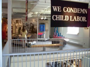 A visitor at the Women’s Rights National Historical Park explores the section of the exhibits that focuses on women, work, and professions. Photo courtesy of the National Park Service.
