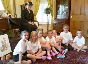 Gretchen Murray Sepik met with “Carriage House Kids” in the parlor at Morgan-Manning House at the end of their three-day program. The actress and storyteller interacted with the group as she acted out stories by Beatrix Potter. Provided photo