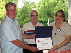 Outgoing president Brad Mitchell (left) and Membership Chair Gene Wood present a Paul Harris Fellowship to Doris Russo. The honor is in dedication to Rotary International’s (RI) founder and first president Paul Harris. A $1,000 contribution to the RI Foundation is presented in the Fellowship honoree’s name.  This year marks the 100th anniversary of the founding of the RI Foundation, which has allowed for major club projects. Provided photo and information.