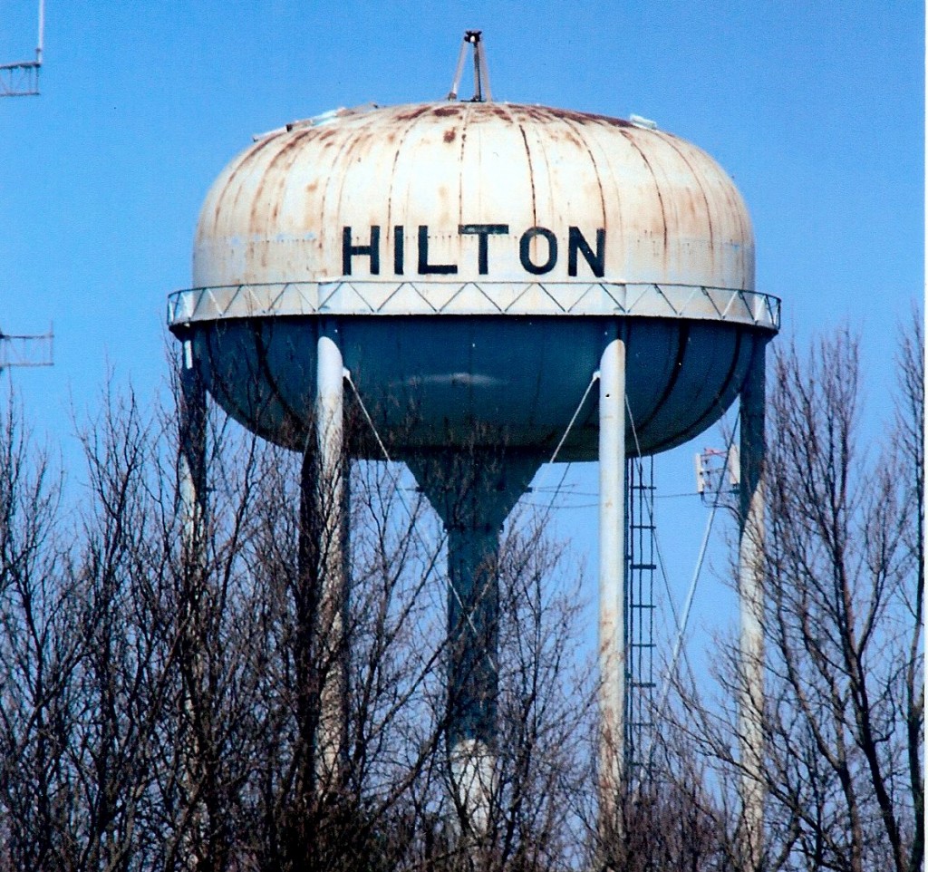 April 14, 2016 The Hilton water tower, sans antennae, awaits a cover so that exterior sandblasting can take place. The water tower, owned by the Village of Hilton, is leased to the Monroe County Water Authority, who has the responsibility to maintain it. The 125 foot structure was installed in 1963 and cost approximately $65,000. The last time it was painted was about 25 years ago.