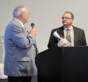  Charter Rotarian Roger Ressman presents a Paul Harris award to Kosmos Mihalitsas in recognition of his volunteerism and dedication to Rotary. Mihalitsas has been a Rotarian since 2009. Provided photo