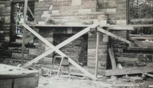 A slide of a photograph in Jennifer Wells-Dickerson’s collection.  It shows construction of a fireplace in one of the shelters at Hamlin Beach State Park.  The shelter and fireplace were constructed of Medina sandstone from the Clarendon quarry owned by her great-grandfather, Pasquale DiLaura. DiLaura worked as the initial mason foreman on the Hamlin Beach project, teaching Civilian Conservation Corps crews how to cut the Medina sandstone.