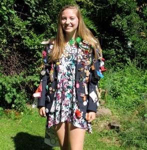 Claudia Drechsel poses outside her home in Murray wearing her Rotary Exchange blazer.  The pins were collected on her recent year-long trip to Austria/Europe. K. Gabalski photo