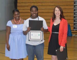 Monroe County 4-H member Malik receives his certificate of graduation from Citizen U program. Provided photo