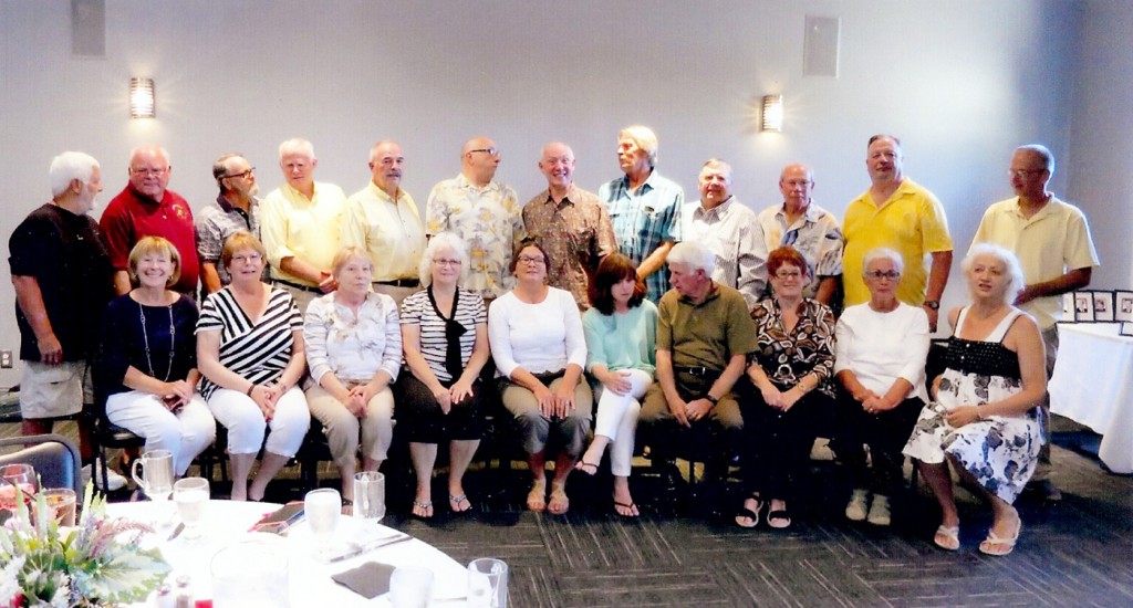 Pictured left to right: back - Mr. Terry Kolb, Ken Hay, Eric Morith, Bill Carruthers, Jim Myers, Rich Herman, Bob Morgan, Ron Smith,  Gary Bater, Leon Pocock, John Welsh, Doug Sullivan (Carol Jenk’s husband); front - Roxy Chapell Myers, Emily McPherson Antinore, Joanne Wienert Toal, Ann Bobzin Campbell, Barb Blue Carruthers, Mary Morris Clancy, Mr. Menzor Dowd, Carol Jenks Sullivan, Martha Pengelly Montgomery, Marg Pask. Provided photo
