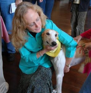 Reverend Krista Cameron, St. Luke’s Episcopal Church, Brockport, blesses her retired Greyhound, Dancey Girl, at a Blessing of the Animals Event. Provided photo