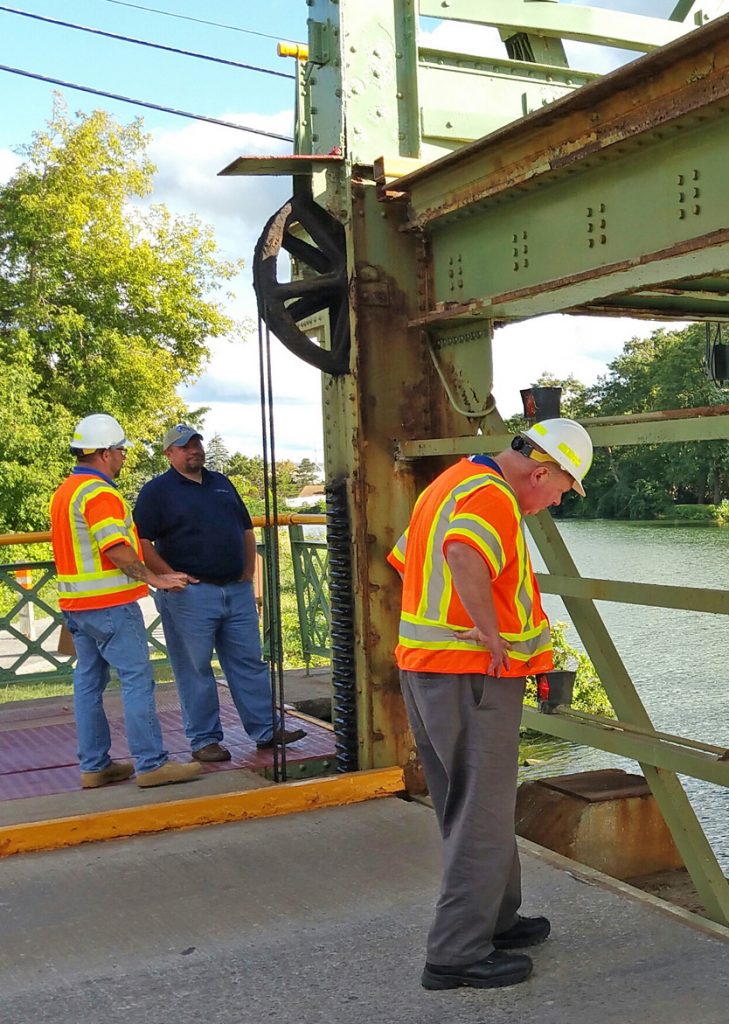 Lift bridge inspection includes examination of pulleys, cables, gears and other mechanism with the bridge raised. Photo by Dianne Hickerson