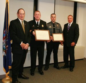 (L to r) Genesee County Sheriff Gary Maha, Ogden Police Chief Christopher Mears, Ogden Police Officer Travis Gray and DCJS Executive Director Michael Green. Provided photo