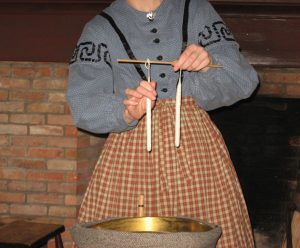 Dipping candles is one of the many activities for demonstration during Genesee Country Village & Museum’s Preparing for the Holidays program. Provided photo