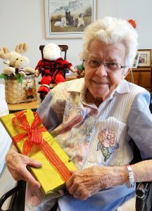  Lakeside Beikirch resident Audrey Van Roo awakened Christmas morning to find a special Christmas gift just for her. She is one of the 120 residents who received a gift selected especially for them, donated by an anonymous benefactor. Photo by Dianne Hickerson