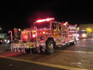 A Holley fire truck makes its way around the Public Square in the village on Saturday, December 10 during the annual Christmas Parade. K. Gabalski photo