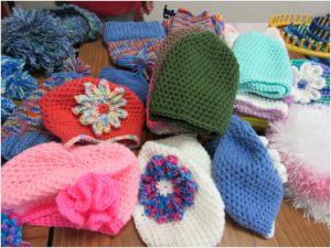 Sample of colorful chemo hats made by the knitters.