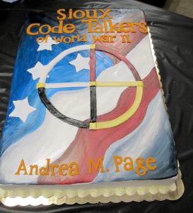 The cake (from Cake Co-op) at the book launch event was decorated to look like the cover of the book. The cover features a symbol which represents the four virtues of tribal life: serenity, bravery, fortitude and wisdom. K. Gabalski photo