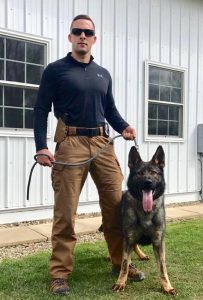 Officer Josh Sime stands with his new K-9 partner, Brock. Provided photo