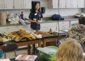 ZooMobile’s Lead Interpreter Karen Wu discusses how poaching is devastating animal populations. She shared confiscated snow leopard and tiger pelts, boa skin and rhino horn. Provided photo