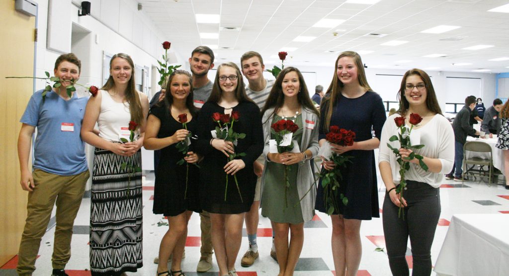 High school student council members were on rose patrol as they handed out roses to the breakfast attendees exiting the cafeteria. Provided photo