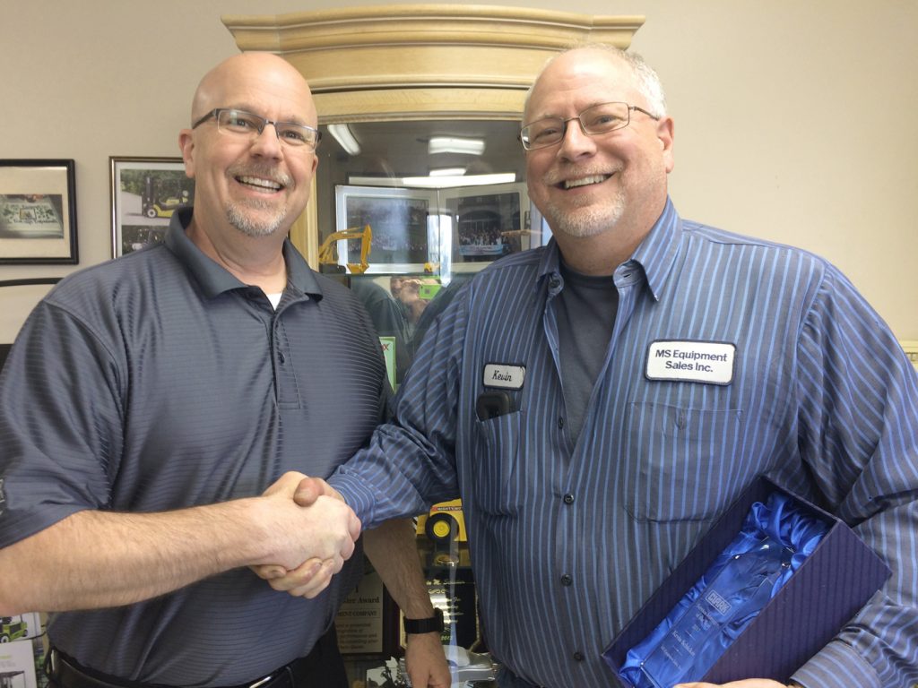 Andy Jurginson, Northeast Regional Coordinator of Clark Material Handling (left), presents Kevin Schicker with the Service Manager of the Year Award. Provided photo 