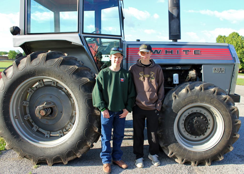 Brothers Garrett and Wyatt Sando with their 1973 White tractor. Provided photo