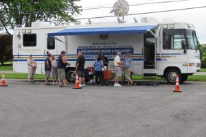 The NYS Department of Financial Services Mobil Command Center was sent by Governor Cuomo for the United Shoreline meeting in Hamlin. It was set up outside the Town Hall. Photo by Stephen Herbeck