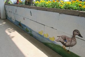 The side of the mural facing the house includes a pond scene with ducks and swans. K. Gabalski photo