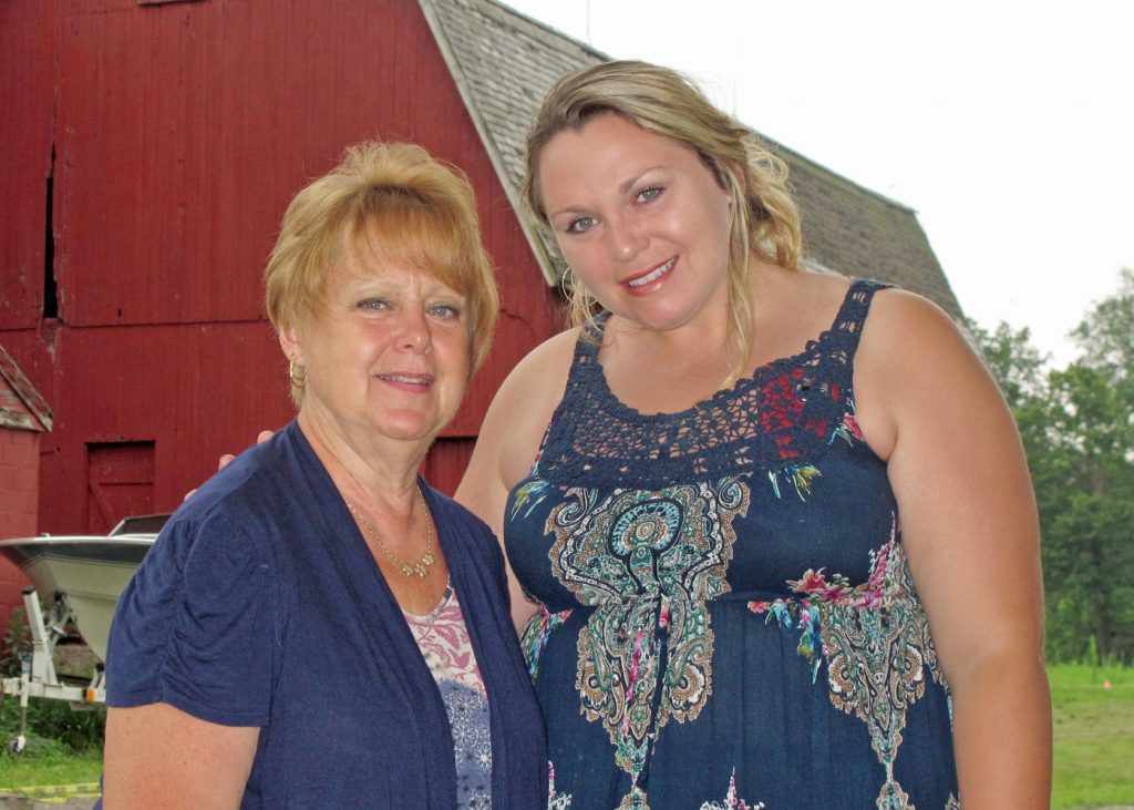 Rotary president Eileen Whitney (left) poses with Jenny Brongo, owner of Homesteads for Hope