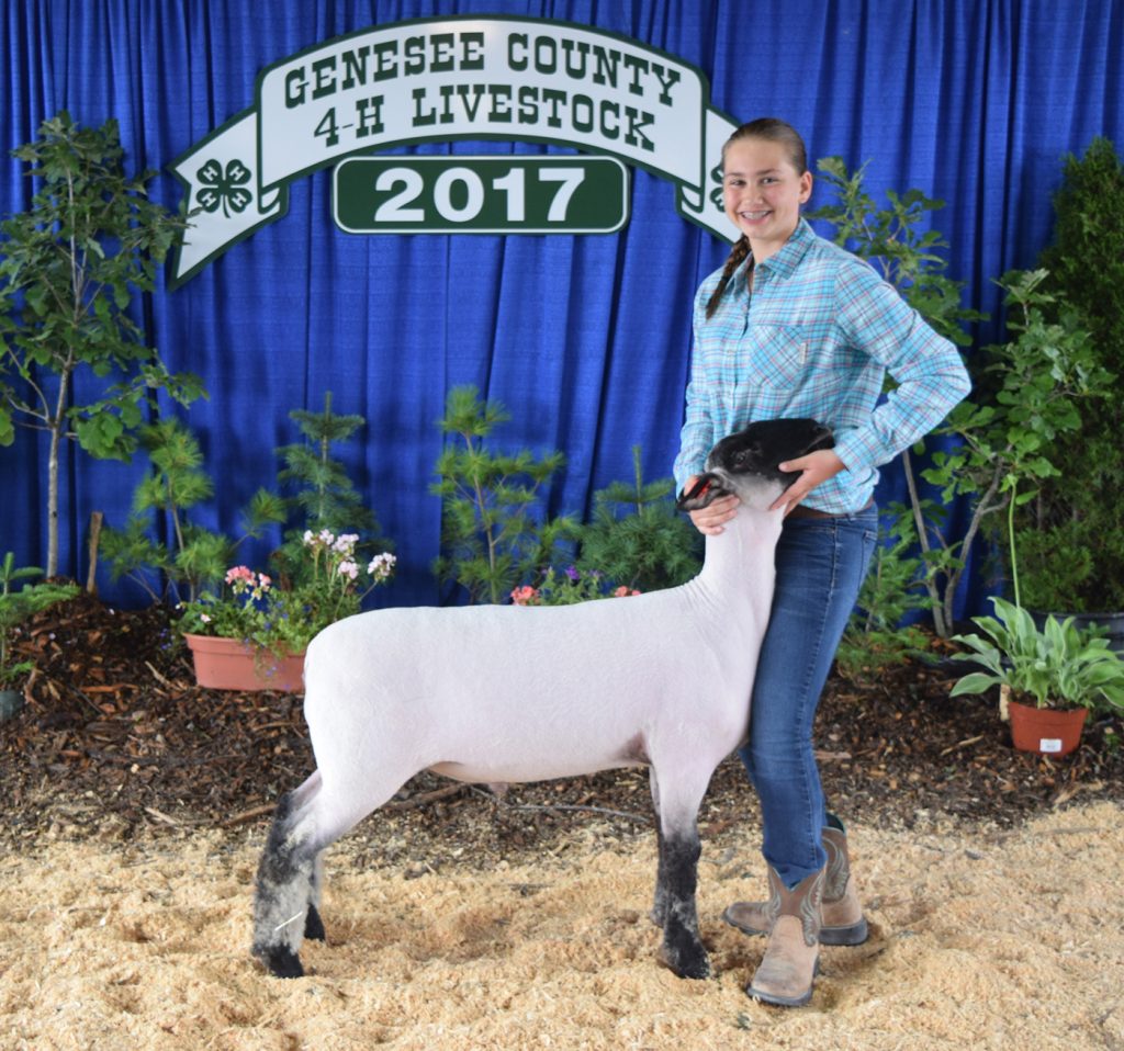 Madelynn Pimm with her Champion Market Lamb.